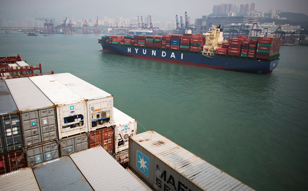 Containers are stacked aboard cargo ships in Hong Kong. Photo: Bloomberg
