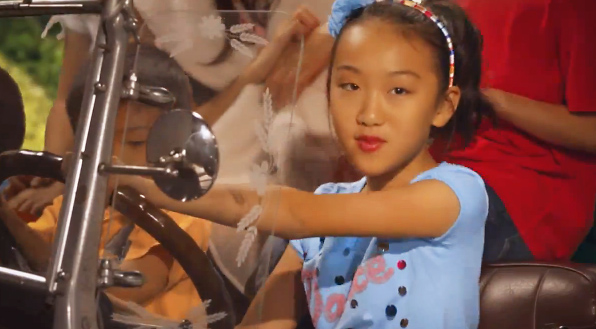 10-year-old Grace Liu flaunts underage driving laws in her new music video. Photo: SCMP Pictures