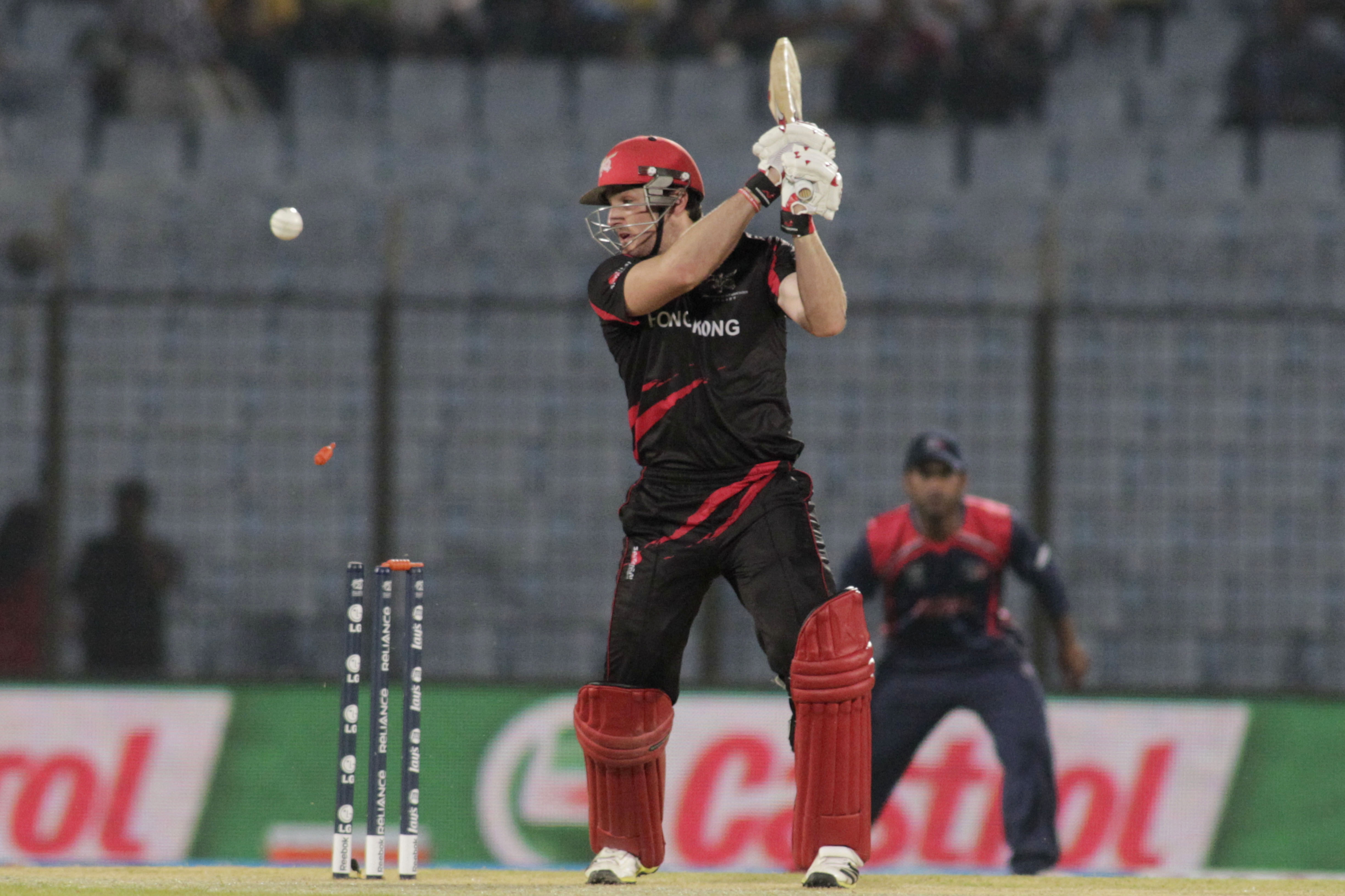 Hong Kong captain Jamie Atkinson is bowled during their ICC Twenty20 World Cup match against Nepal in Chittagong. Photo: AP