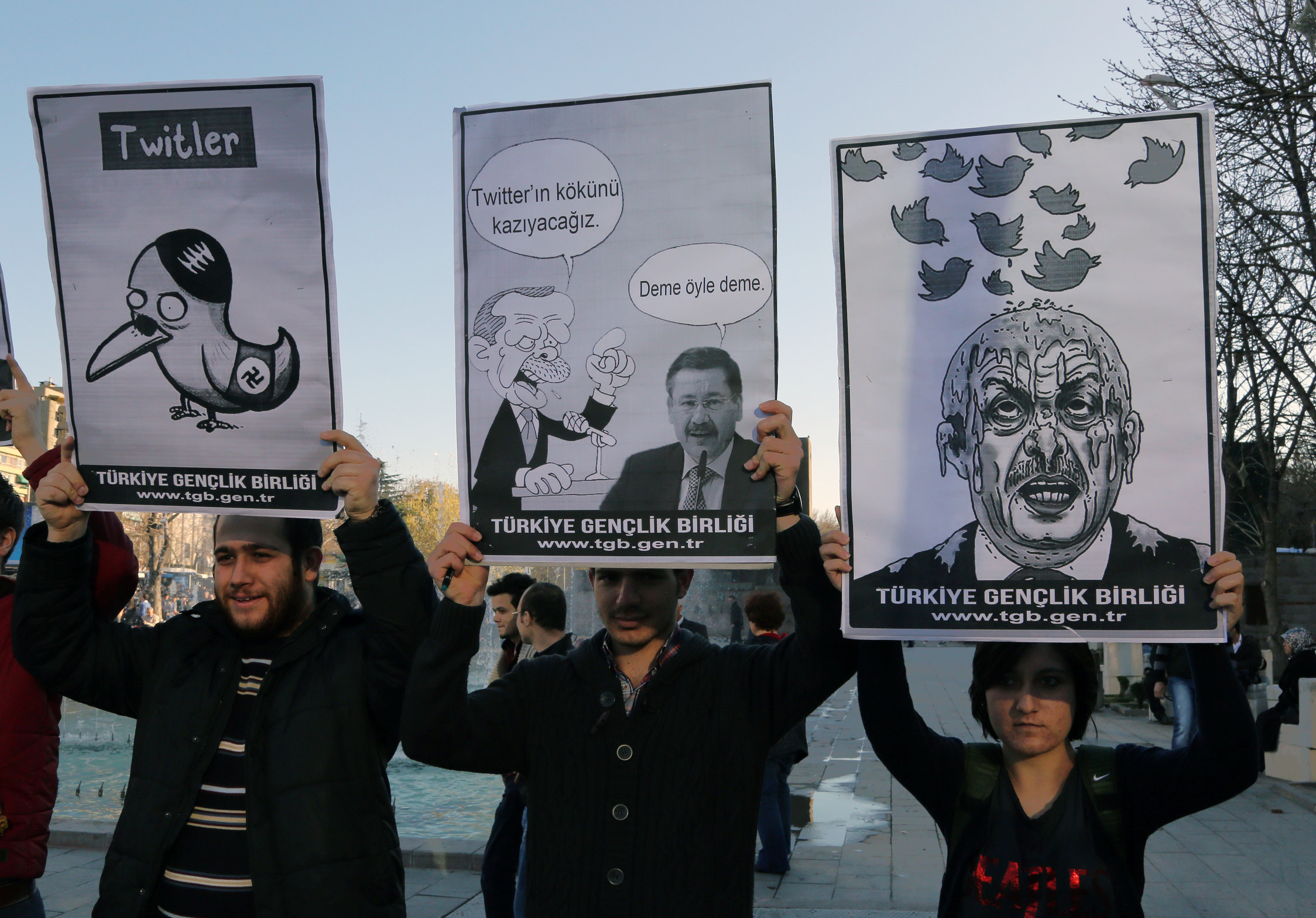 Members of the Turkish Youth Union hold cartoons depicting Turkey's Prime Minister Recep Tayyip Erdogan during a protest against a ban on Twitter in Ankara, Turkey on Friday. Photo: AP 