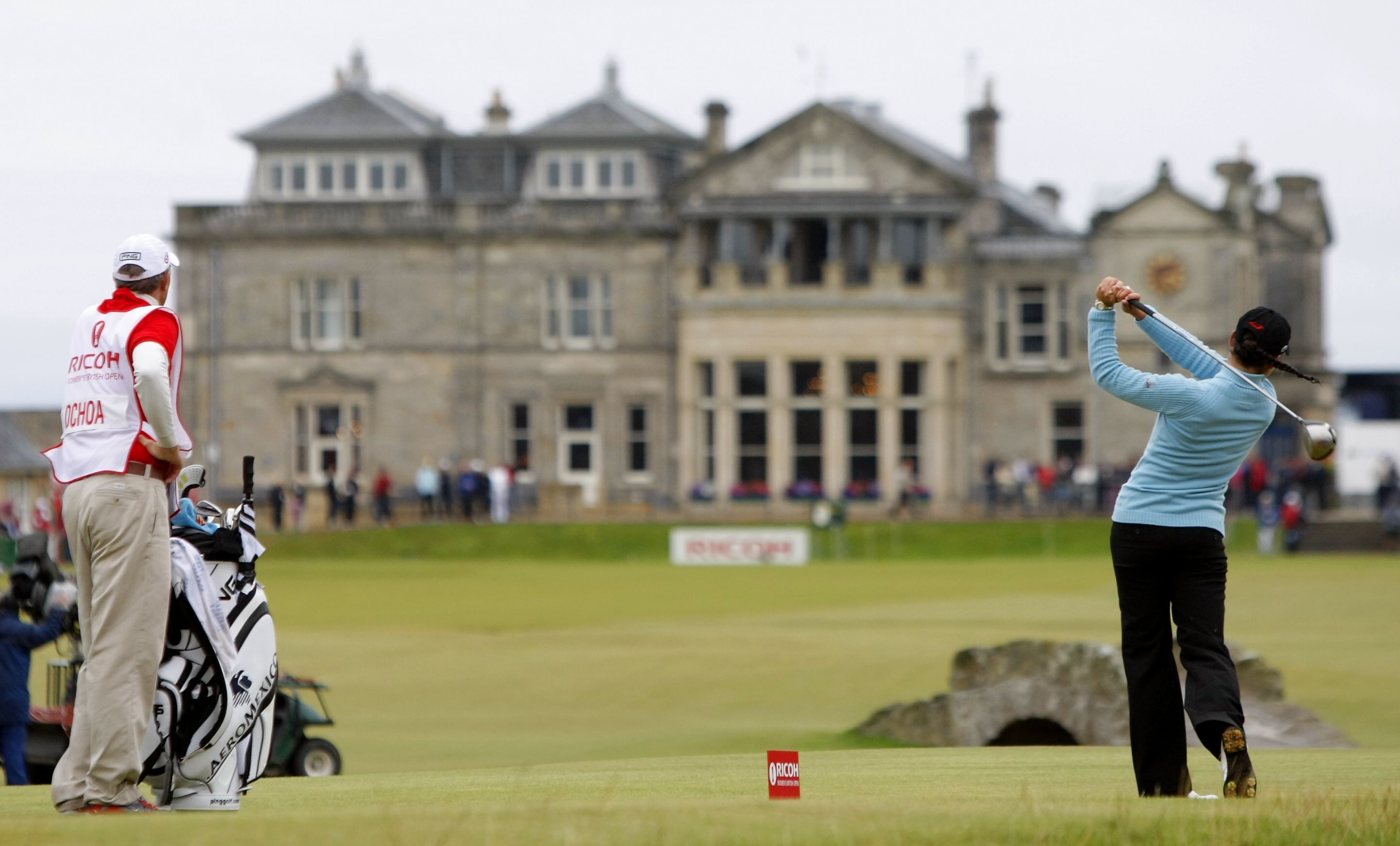 World No 1 Lorena Ochoa tees off from the 18th with the St Andrews in the background. The Women's British Open was held on the Old Course, which allows female players. Photo: AP