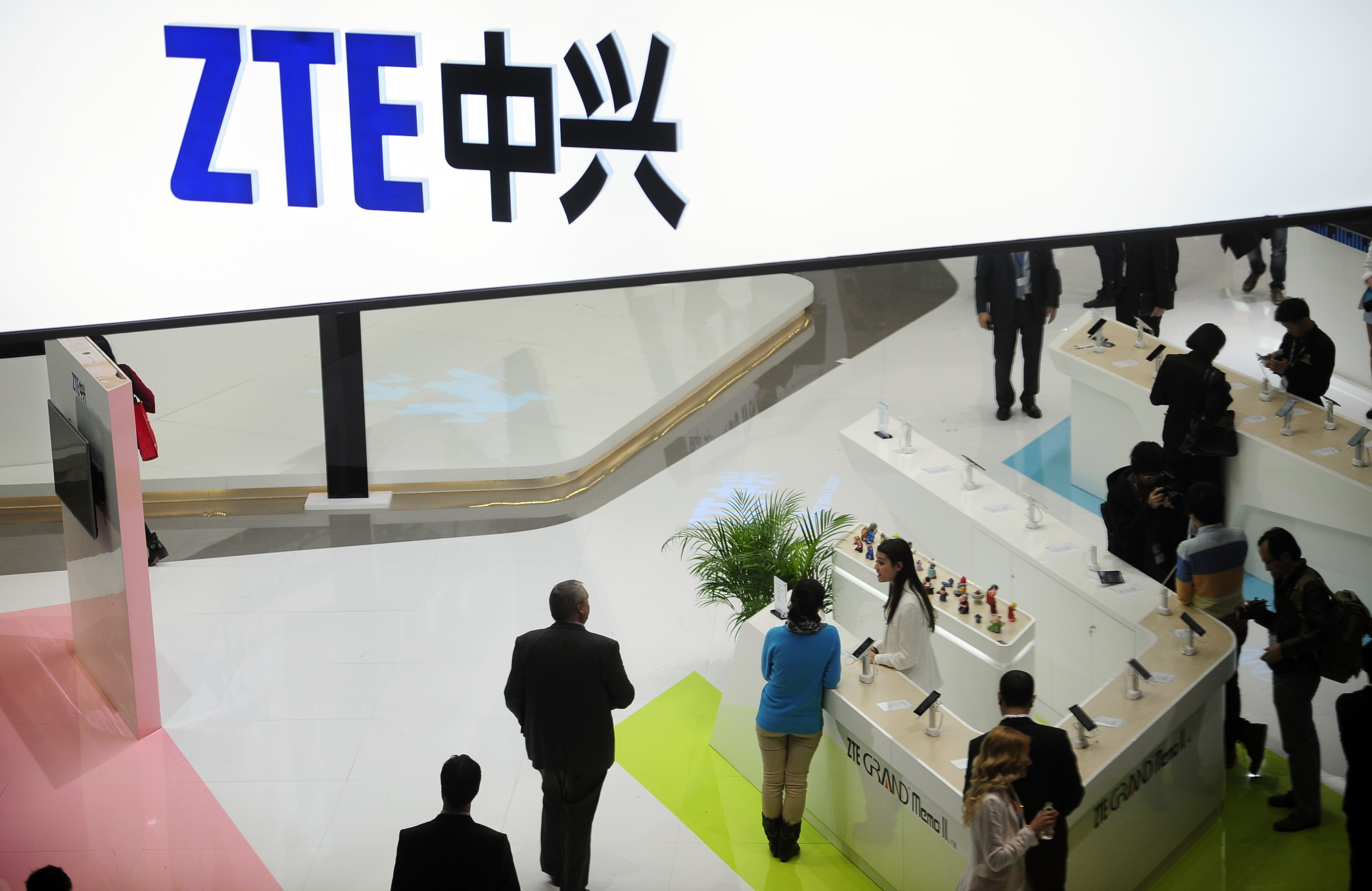 People gather at the ZTE booth at the Mobile World Congress, the world's largest mobile phone trade show in Barcelona, Spain. Photo: AP