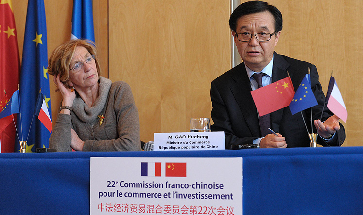 French Trade Minister Nicole Bricq (left) with China's Trade Minister Gao Hucheng during the 22nd Franco-Chinese commission for Trade and Investment on February 24 in Paris. Photo: AFP