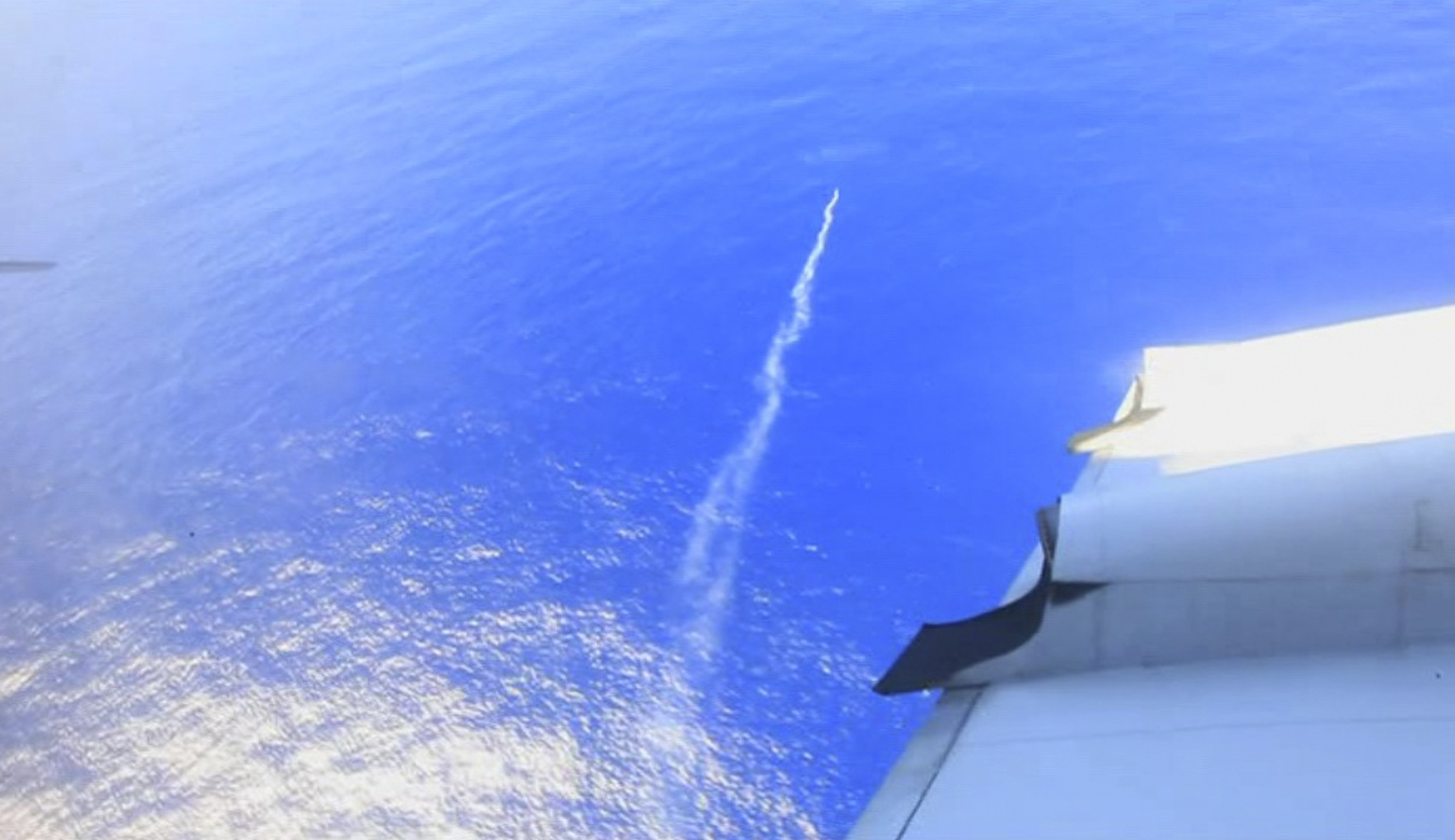 A marker flare is deployed into the Indian Ocean by a Royal New Zealand Air Force plane searching for debris.  Photo: AP