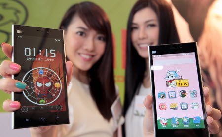 Models show off the newest Xiaomi phone models during a Hong Kong press conference. Photo: Thomas Yau