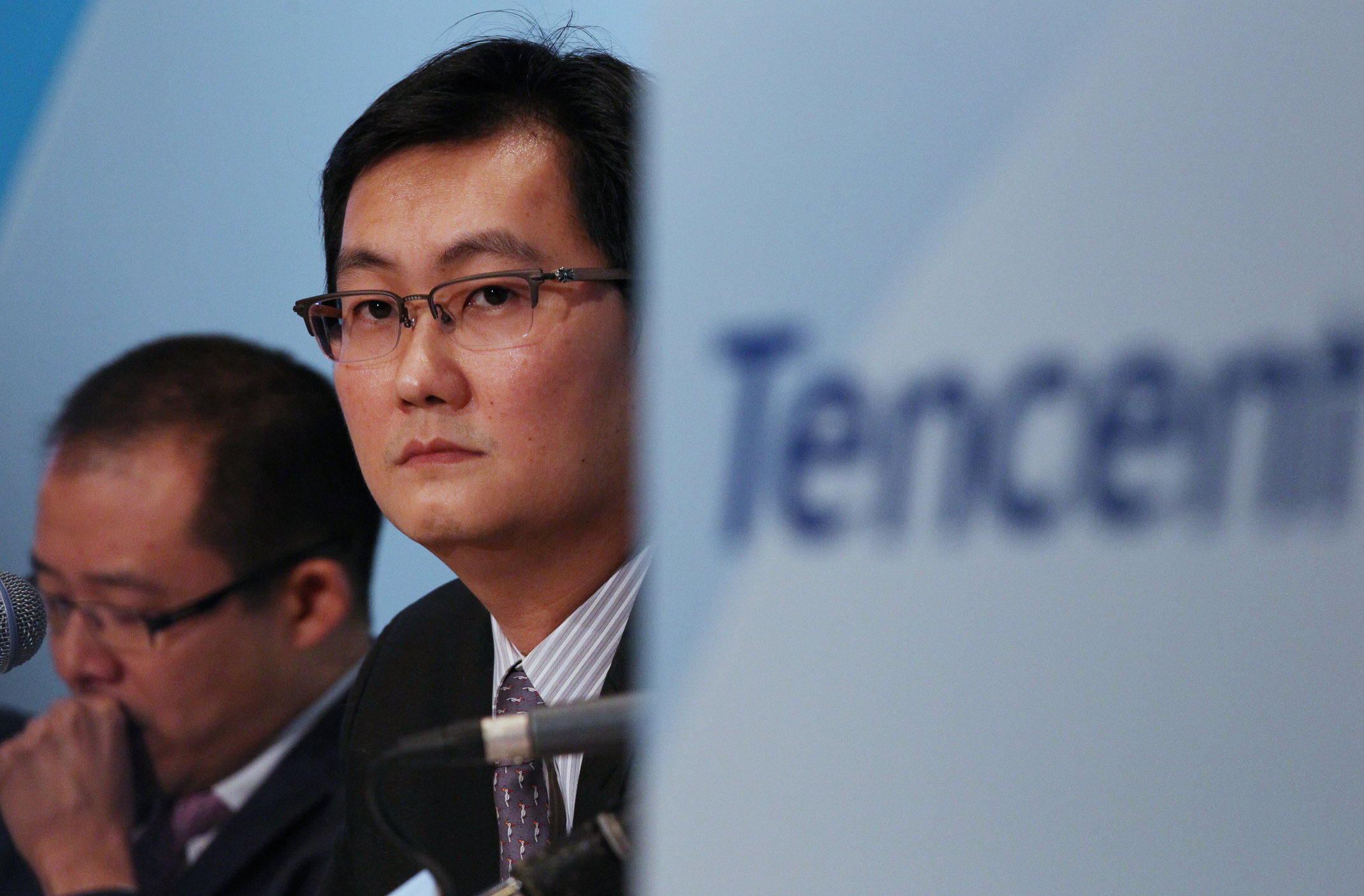 Martin Lau Chi-ping, President; and Pony Ma Huateng, Chairman and CEO, Tencent Holdings Limited, announce the company's 2013 fourth quarter and annual results. Photo: SCMP