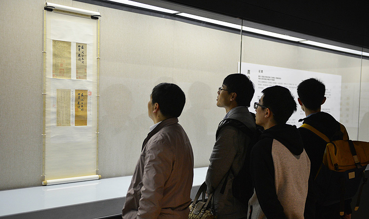 Visitors to the newly-opened Long Museum West Bund in Shanghai look at the ancient scroll that cost museum owner Liu Yiqian US$8.2 million. Photo: AFP