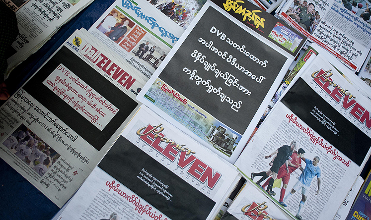 Newspapers with a black front page at a stall in Yangon on Friday after Zaw Pe, a journalist for the Democratic Voice of Burma, was convicted of trespassing and "disturbing a civil servant". Photo: AFP