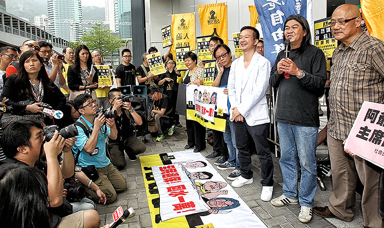 Lawmakers Raymond Chan Chi-chuen, Leung Kwok-hung and Albert Chan Wai-yip and members of People Power and League of Social Democrats protest outside Legislative Council in Tamar after council president Jasper Tsang Yok-sing decided to end the filibuster on the debate of the budget in 2013. Photo: Dickson Lee