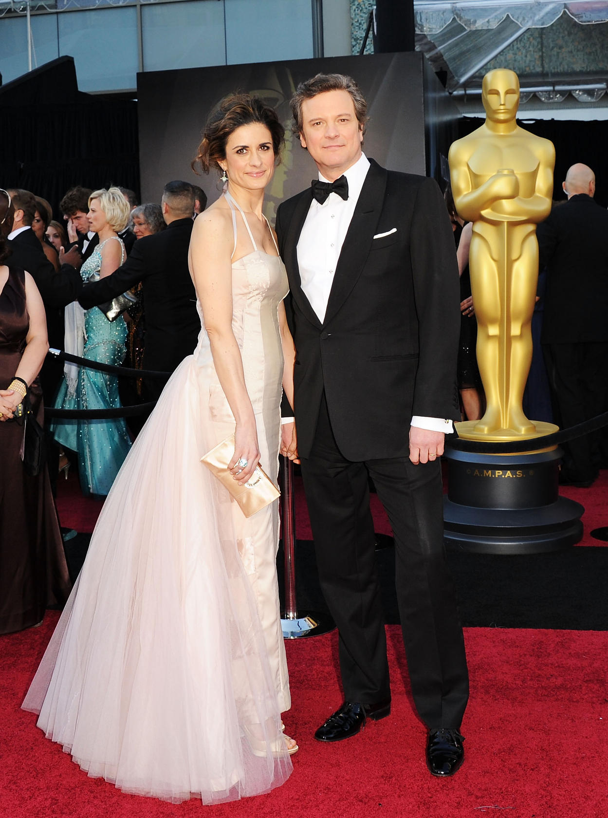 Livia and Colin Firth at the Academy Awards in 2011. Livia is wearing a Gary Harvey dress that's patched together from 11 vintage frocks. Photo: AFP