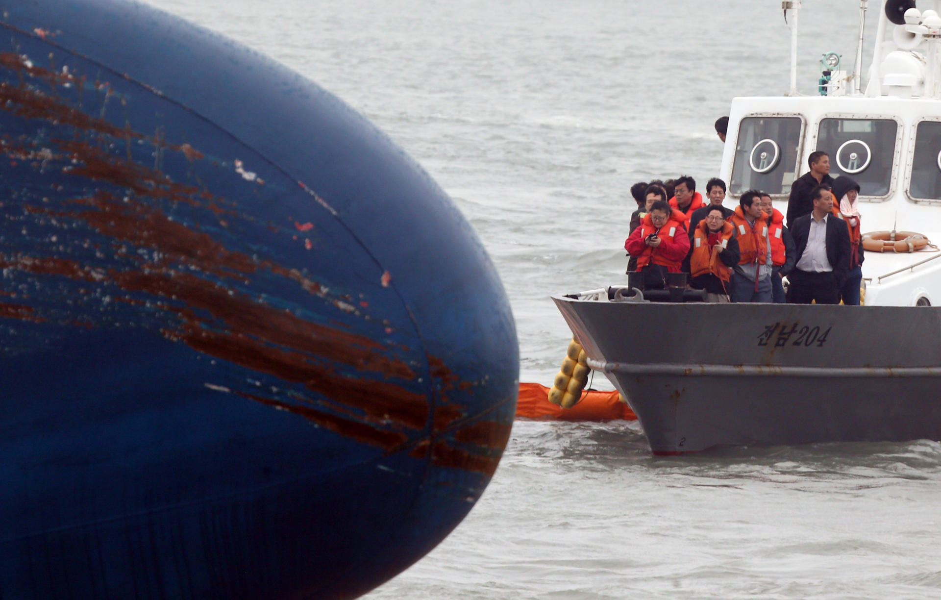Relatives of missing passengers visit the area where the ferry sank off Byeongpung island. Photo: AFP