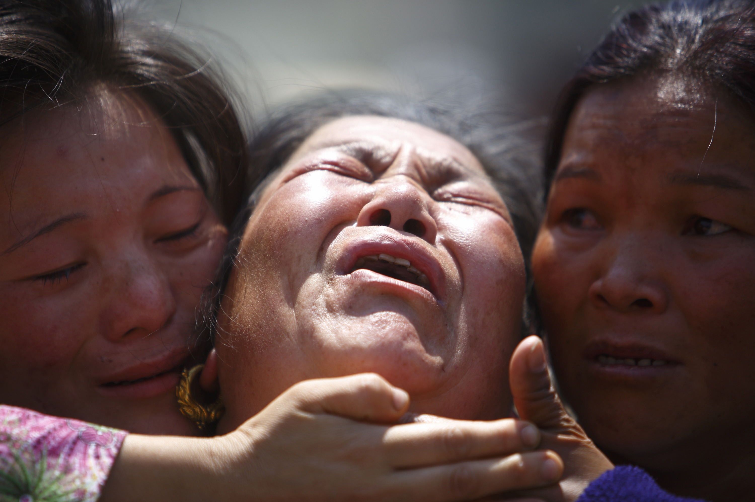A relative of one of the Sherpa's killed in last Friday's avalanche is comforted during Monday's funeral service in Kathmandu. Photo: Reuters