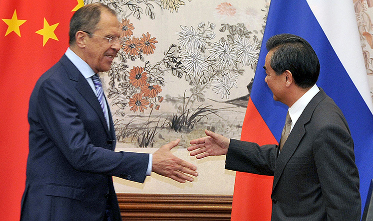 Russian Foreign Minister Sergey Lavrov and Chinese Foreign Minister Wang Yi meet in Beijing on April 15. Photo: AFP