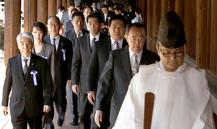 Japanese lawmakers led by a Shinto priest visit the Yasukuni Shrine in Tokyo on Tuesday. Photo: Reuters
