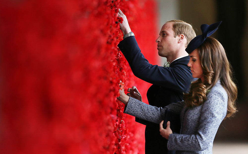 Prince William and his wife, Kate, place poppy flowers on the first world war Wall of Remembrance at the Australian National War Memorial, on Anzac Day in Canberra. Photo: Reuters