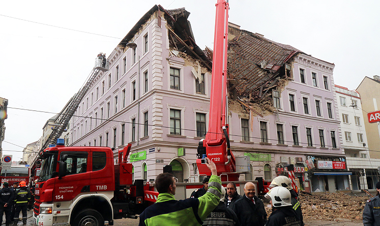 Firefighters and police at a building damaged by an explosion in Vienna, Austria, on Saturday. Photo: AP