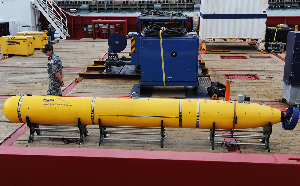 The Bluefin-21 submersible on the deck of the Australian navy ship Ocean Shield as it replenishes supplies and conducts routine maintenance and software modifications. Photo: AFP