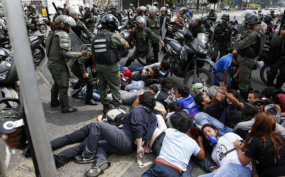 National guards detain a group of anti-government protesters during a protest in Caracas. Photo: Reuters