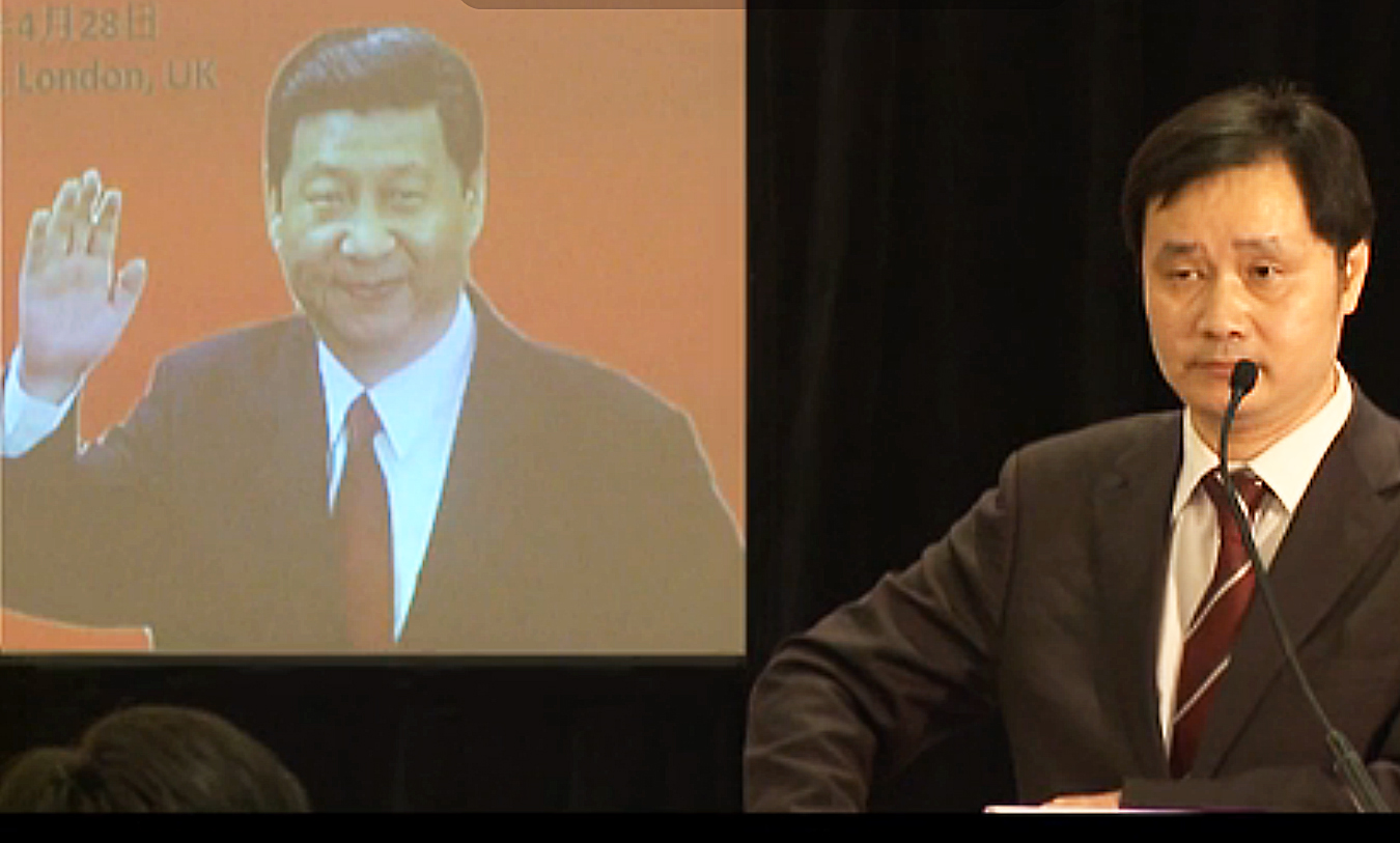 Publisher Edward Huang (right) hosted a forum last month on how Xi Jinping "will change the world", in a screengrab from a video of the event on Youkou.com. Photo: SCMP Pictures