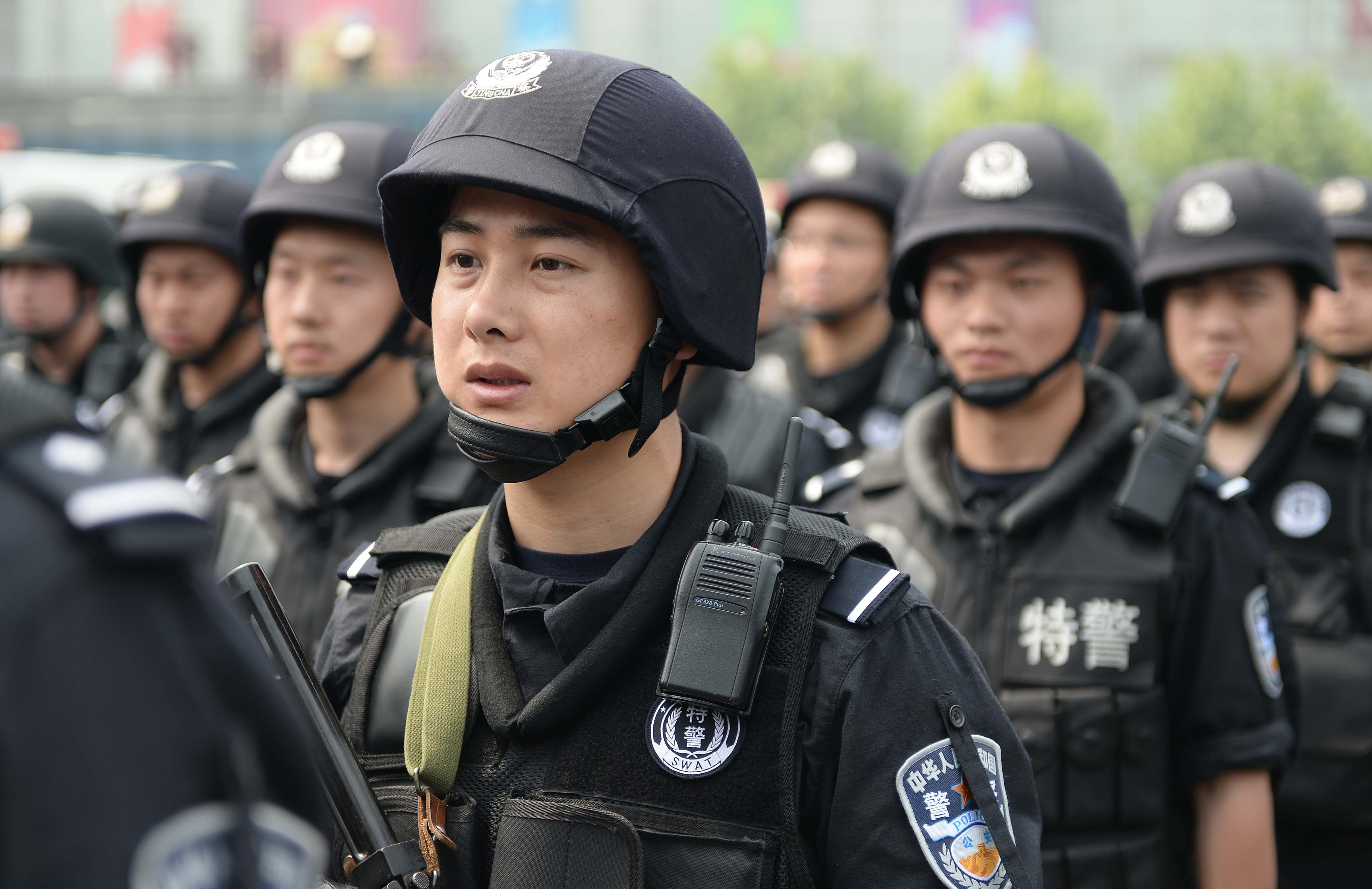 Security personnel take part in joint armed patrols to guard Shanghai railway station. Photo: AFP