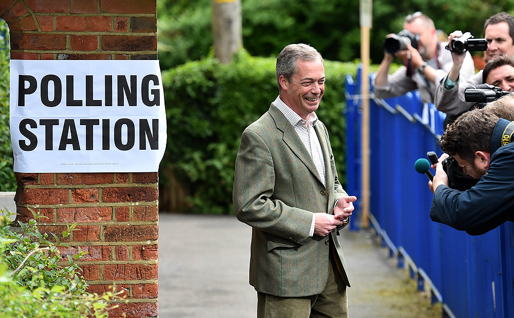 UKIP leader Nigel Farage poses for photographers near Biggin Hill, south of London, before voting in the local and European elections on Thursday. Photo: AFP 