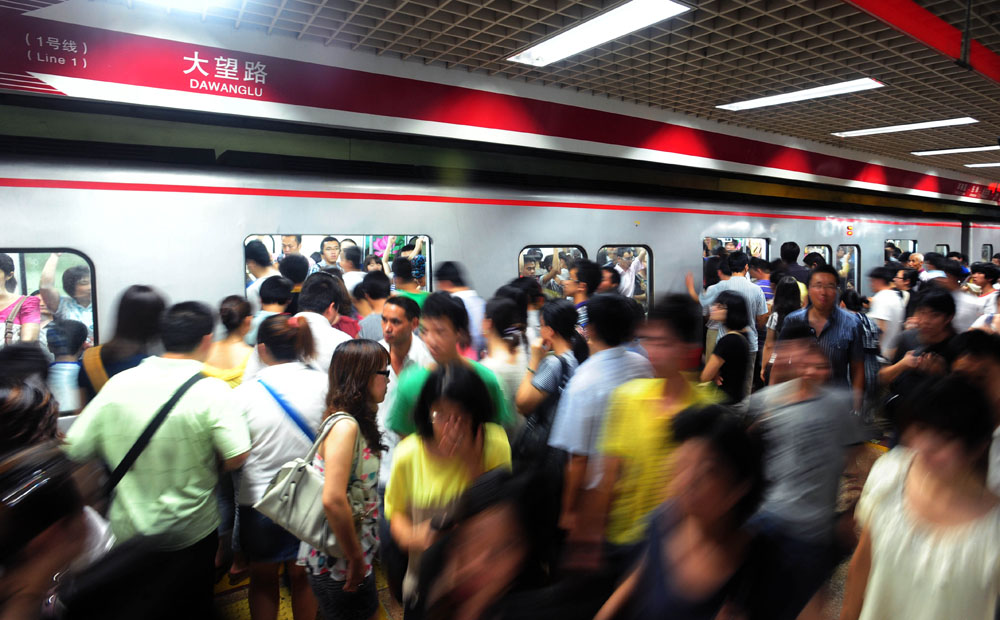 Busy platform during the rush hour in a Beijing underground station. 