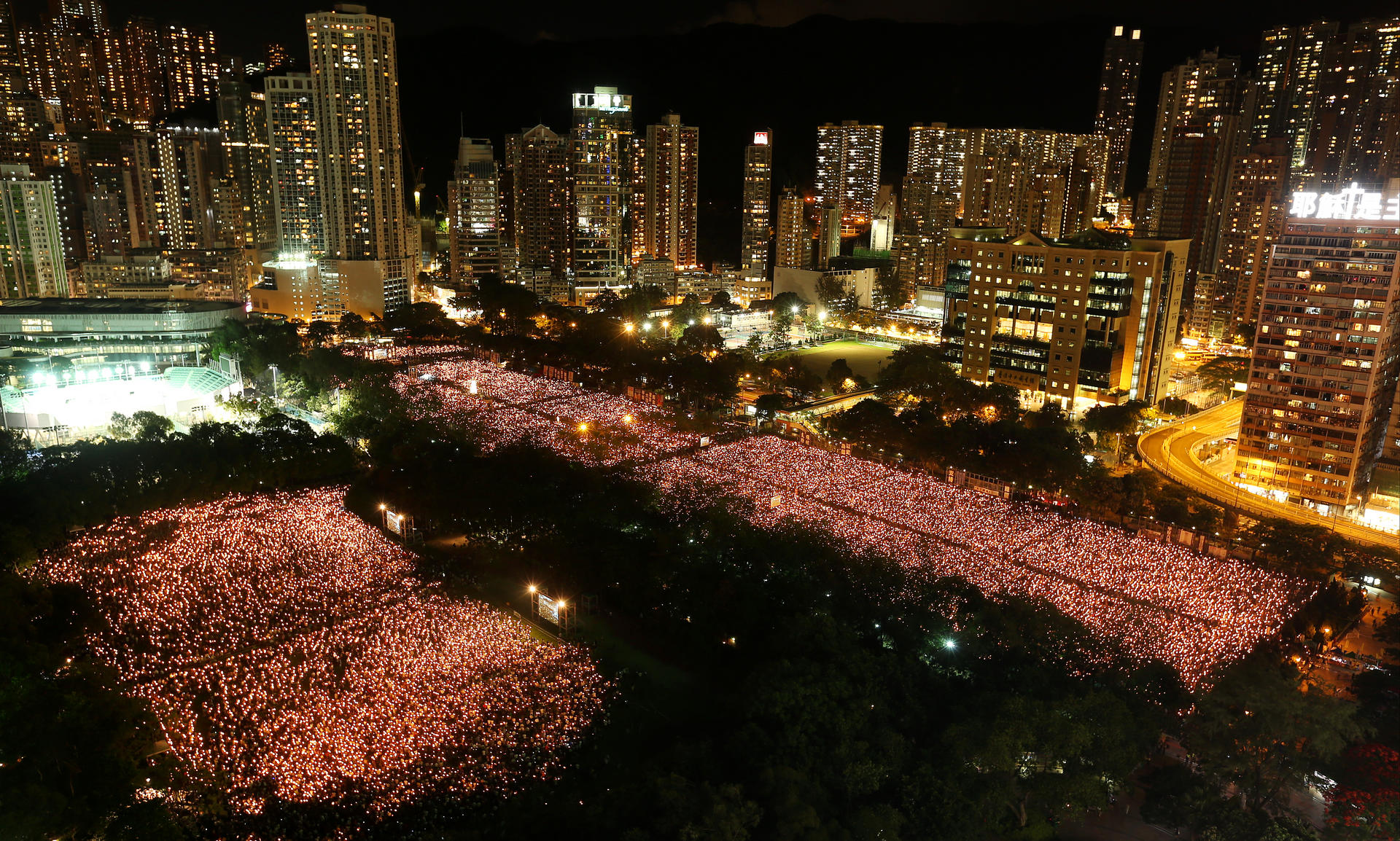 Victoria Park shines with a sea of candlelight during the vigil, which drew at least 99,500 people to markthe 25th anniversary of the Tiananmen crackdown. Photo: K. Y. Cheng