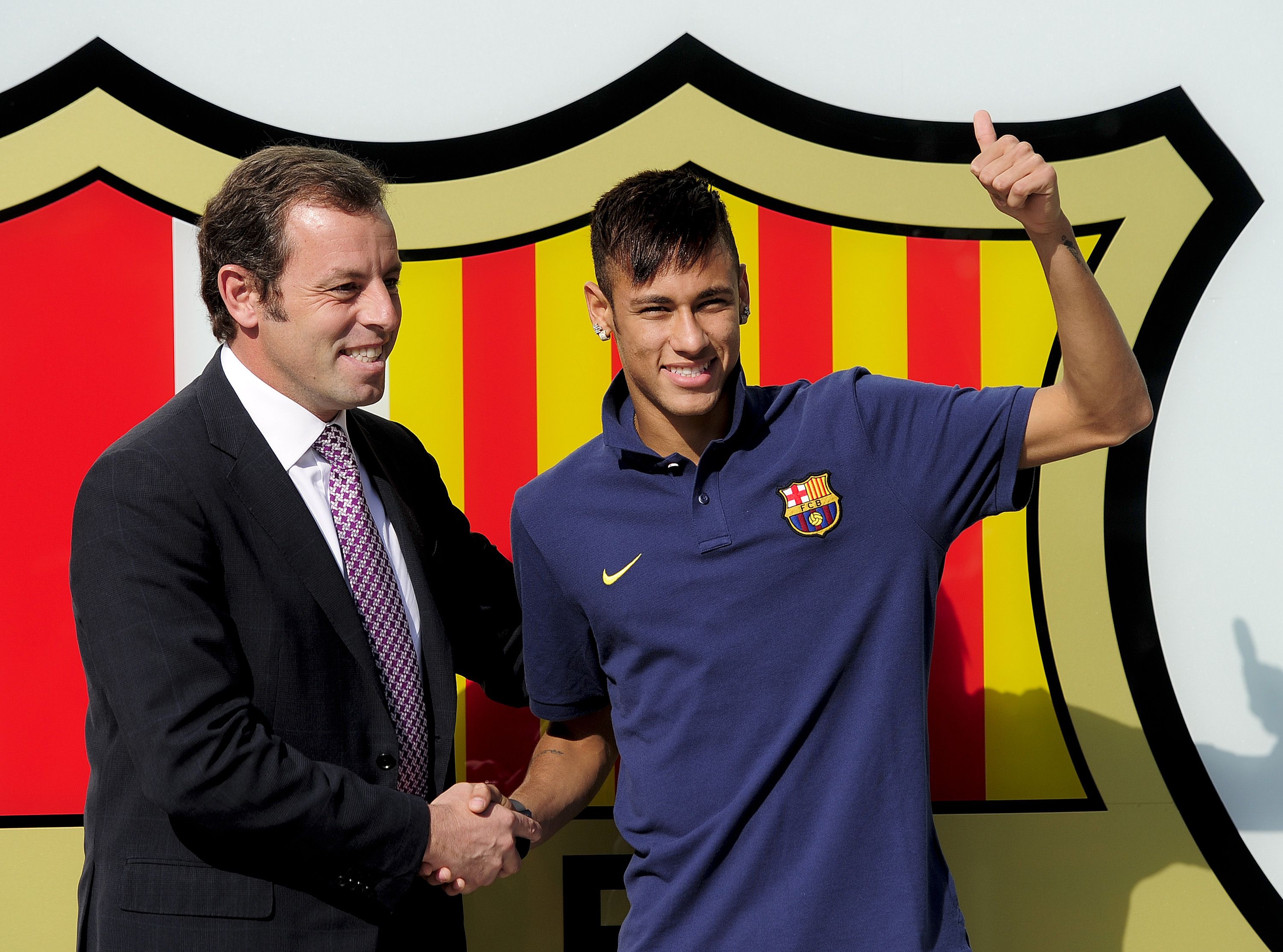 Brazilian international Neymar with then president of Barcelona FC Sandro Rosell at Camp Nou stadium just after signing him in 2013. Photo: AFP 