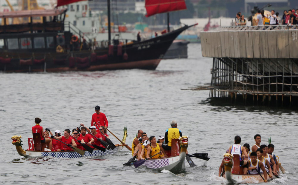 The annual Dragon Boat Carnival gets under way yesterday on the Tsim Sha Tsui side of Victoria Harbour. Photo: Nora Tam