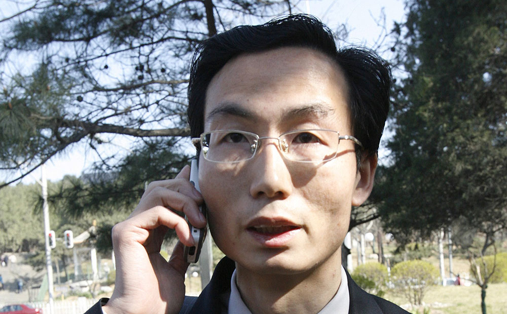 Rights lawyer Li Fangping talks on his phone outside the Beijing Number One Intermediate People's Court in this April, 2008 file picture. Photo: Reuters