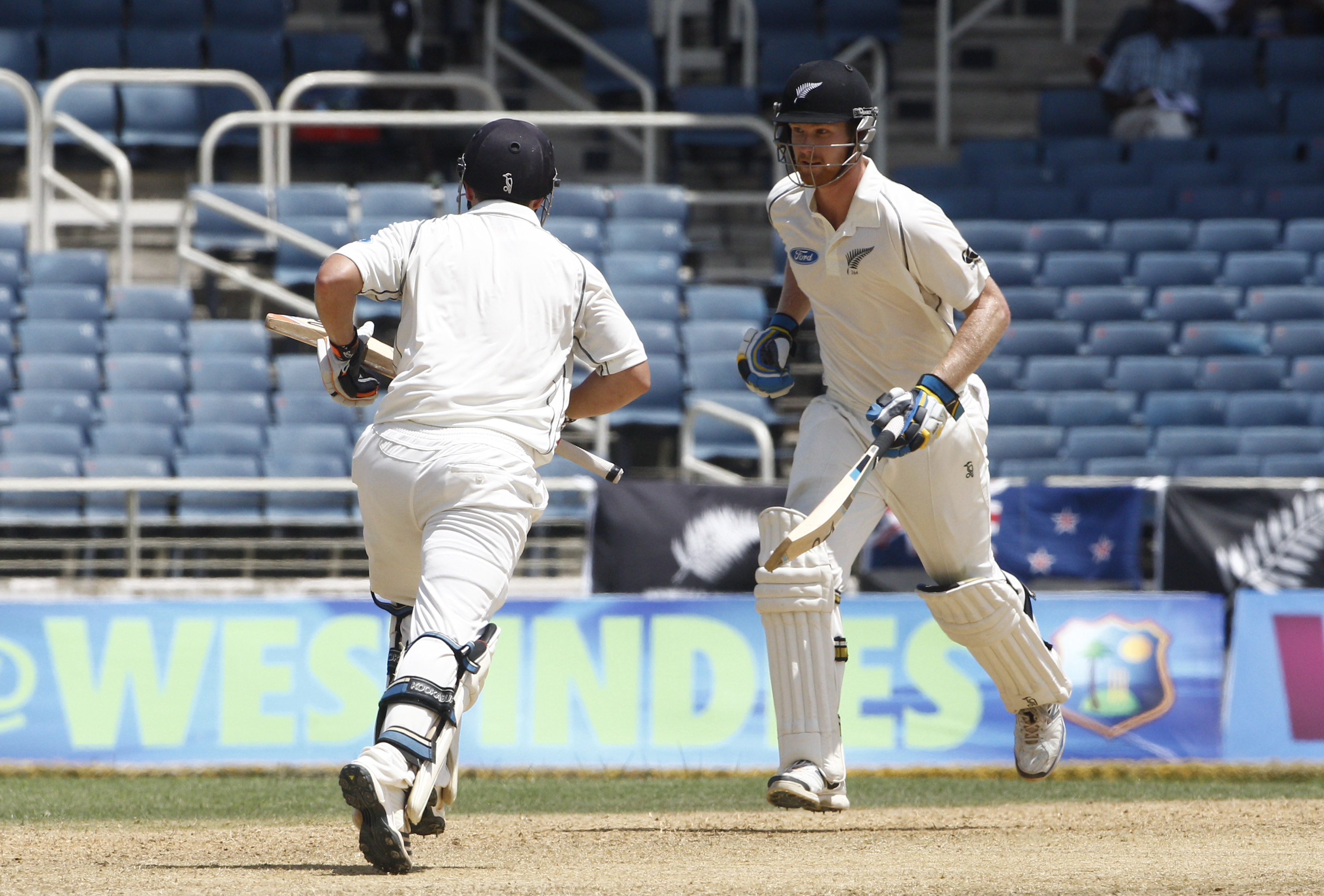 New Zealand batsmen BJ Watling (right) and Jimmy Neesham run between the wickets during the second day of their first test match against West Indies in Kingston. Photo: AP
