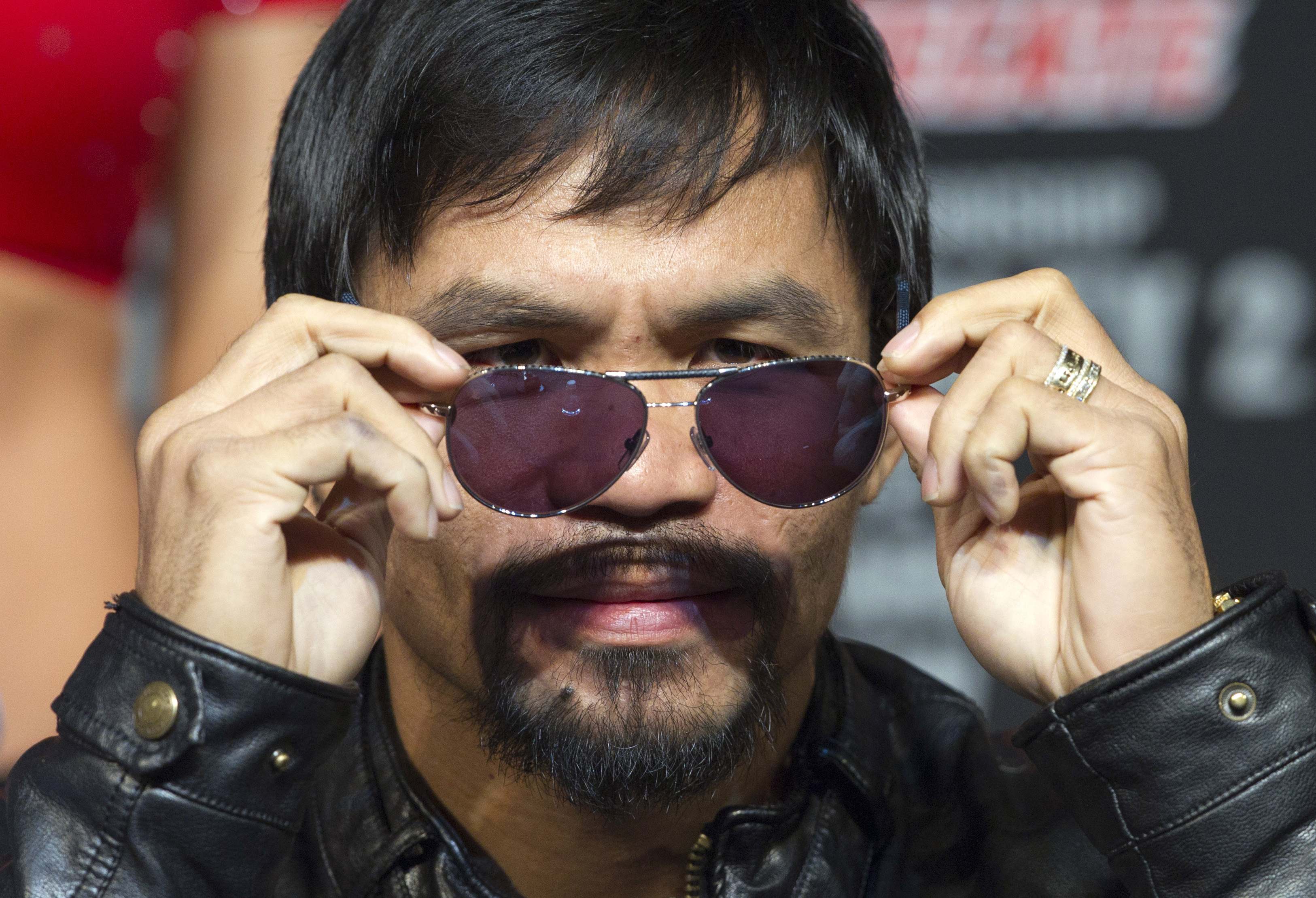 Manny Pacquiao is heading into a new sporting arena and he is unlikely to get bloody and bruised as he takes up a post as basketball coach. Photo: Reuters 