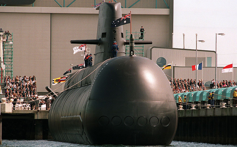 This file photo shows Australia's first high-tech Collins-class submarine being lowered into the water at Port Adelaide. Photo: AFP