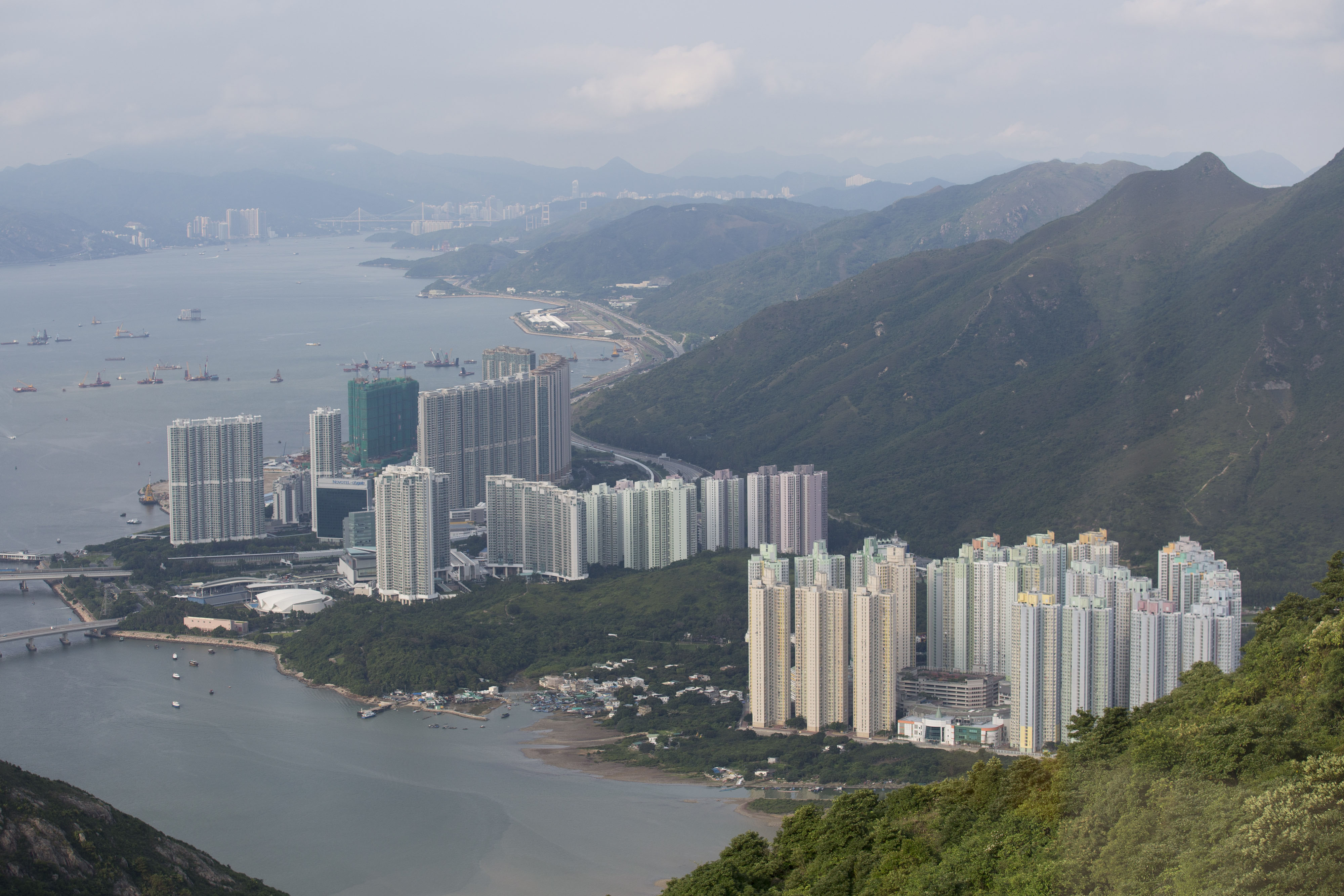 The government must carry out more studies on local air pollution if it is to convince the public that further expansion of Tung Chung new town will not pose a risk to health, a green group says. Photo: Bloomberg