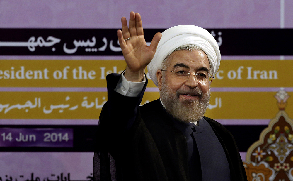 Iranian President Hassan Rouhani waves after speaking at a press conference in Tehran on Saturday. Photo: AP
