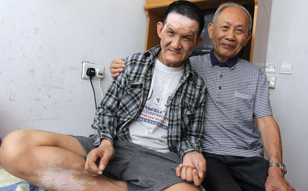 Doting dad Yip Kie-chun has sacrificed everything to care for his mentally disabled son Yip Chi-wo. For Yip, a smile from his son is all he wants on Father's Day. Photo: Edward Wong