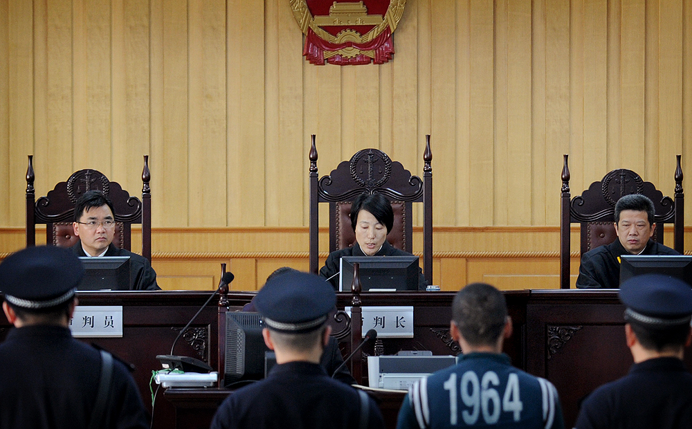 Overseeing judges and prosecutors separately from administrative workers in the civil service would improve the professionalism of judicial staff, the report said. Photo: Xinhua