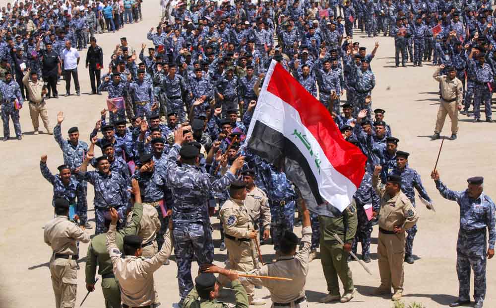 Volunteers, who have joined the Iraqi security forces to fight the ISIL, gather in Najaf. Photo: Reuters