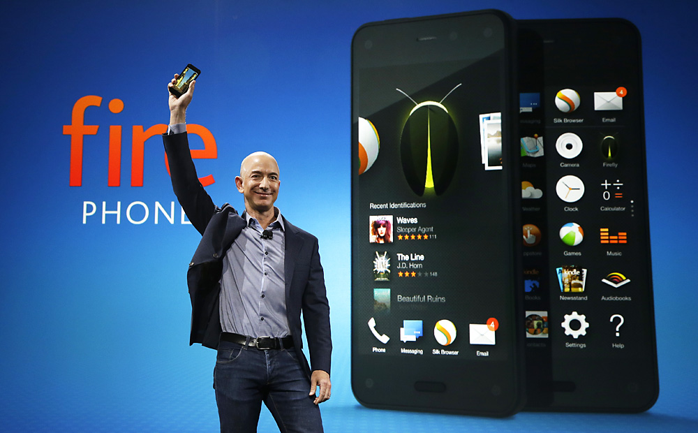 Amazon CEO Jeff Bezos demonstrates the new Amazon Fire phone on Wednesday in Seattle. Photo: AP