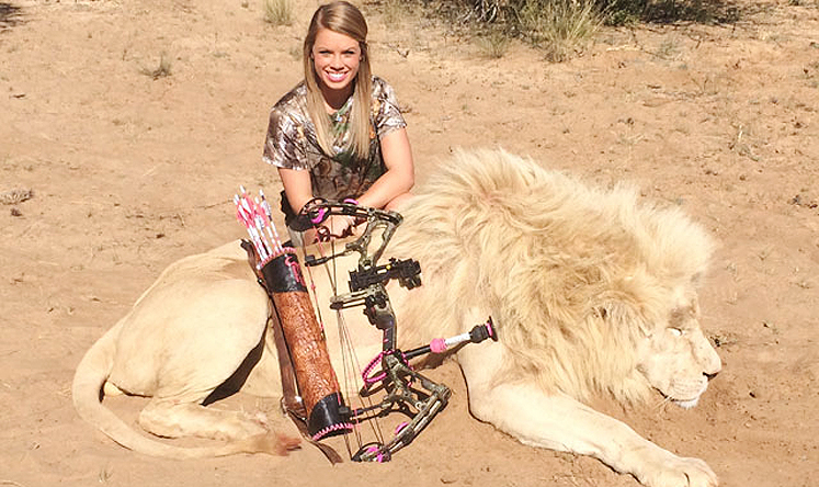 Kendall Jones poses with a dead lion in one of the pictures removed by Facebook. Photo: Screenshot