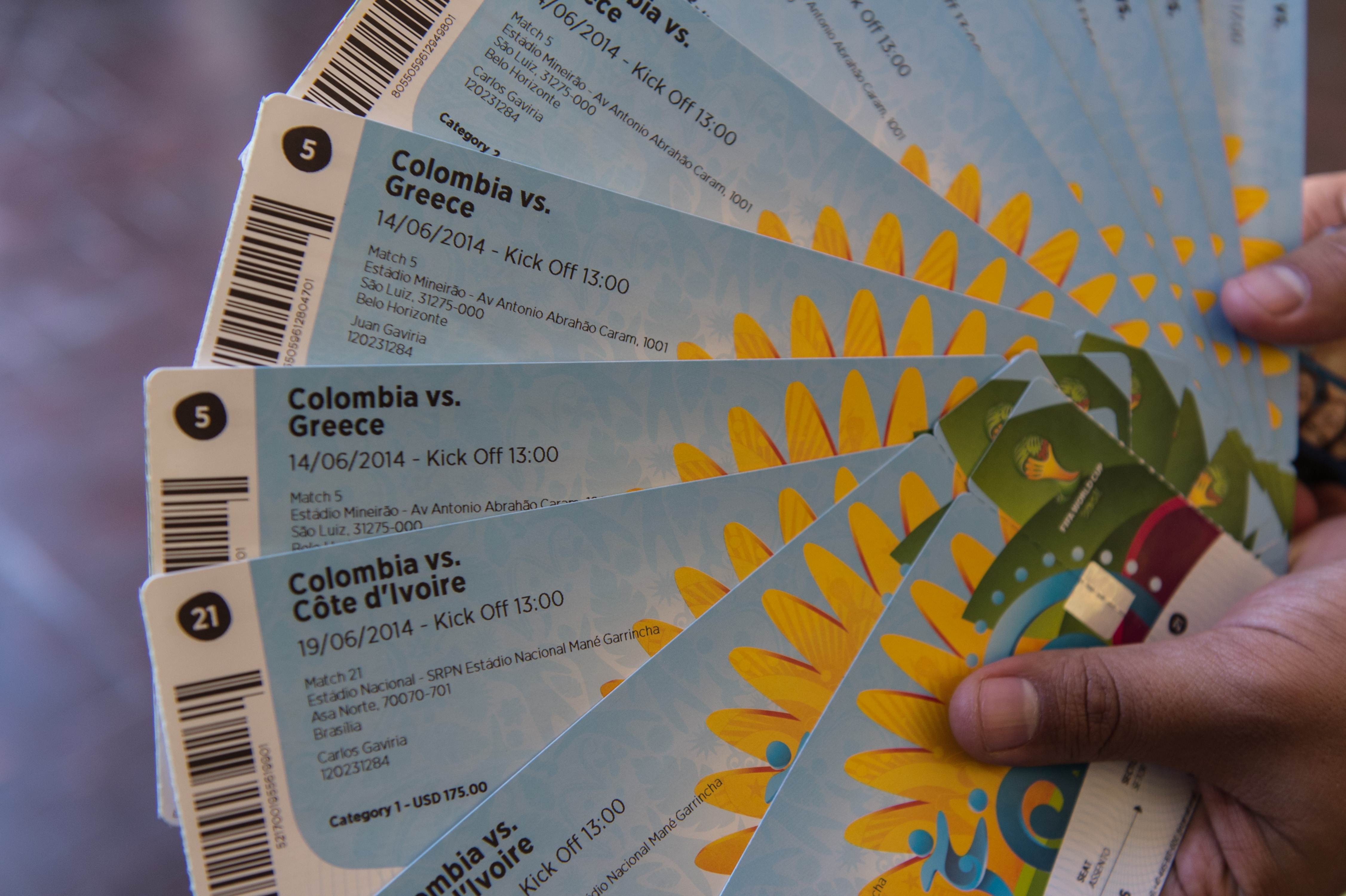 A football fan shows tickets he bought legally, but there are many online going for US$6,000 each for the World Cup final. Photo: AFP