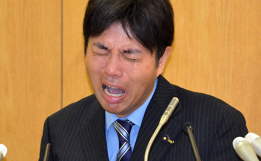 Provincial politician Ryutaro Nonomura crying at a press conference on July 1 while failing to explain his profligate use of public funds in Japan's Hyogo prefecture. Photo: AFP