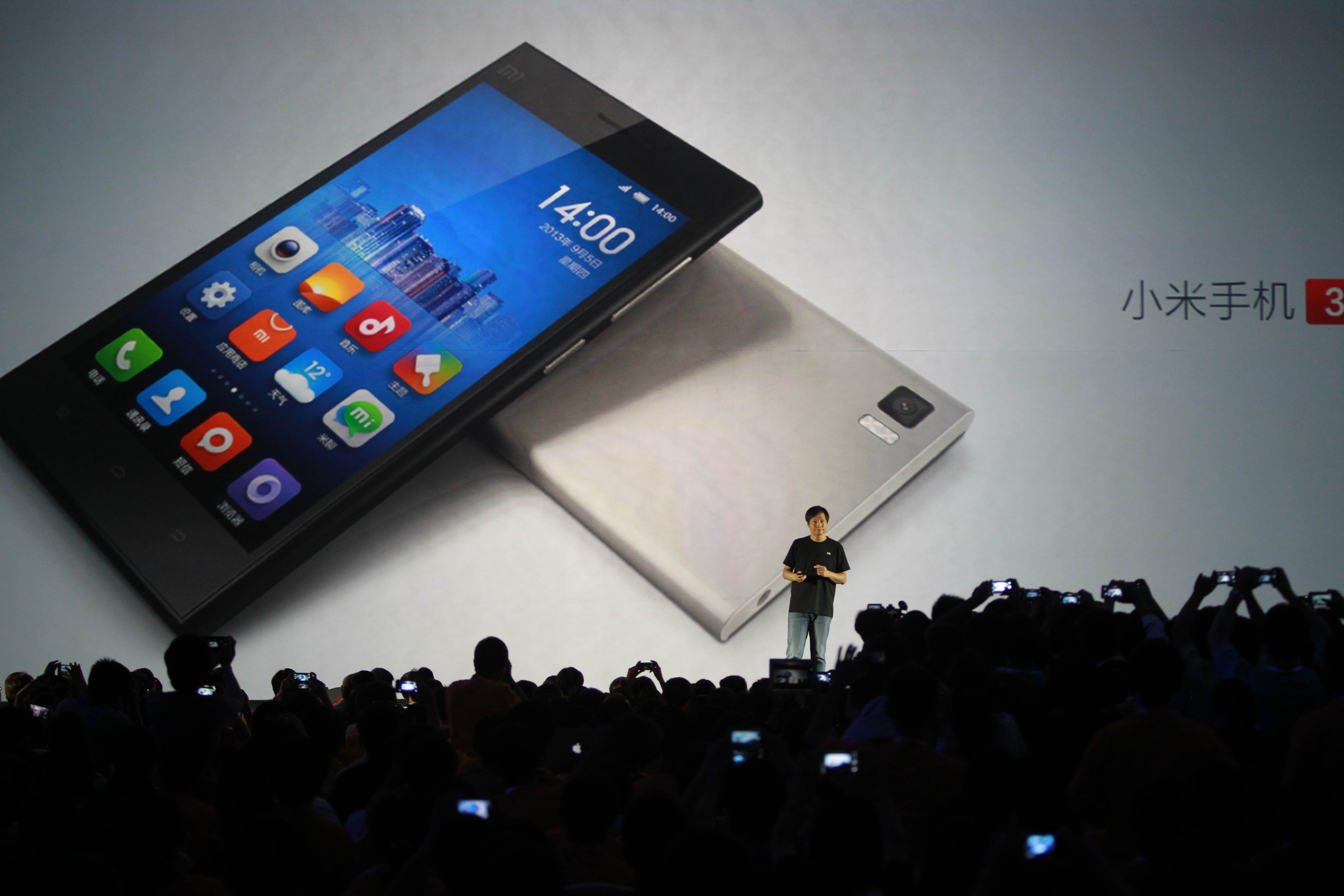 Lei Jun, founder of Xiaomi, introduces the new Xiaomi 3 smartphone and Xiaomi TV in Beijing. Photo: Simon Song