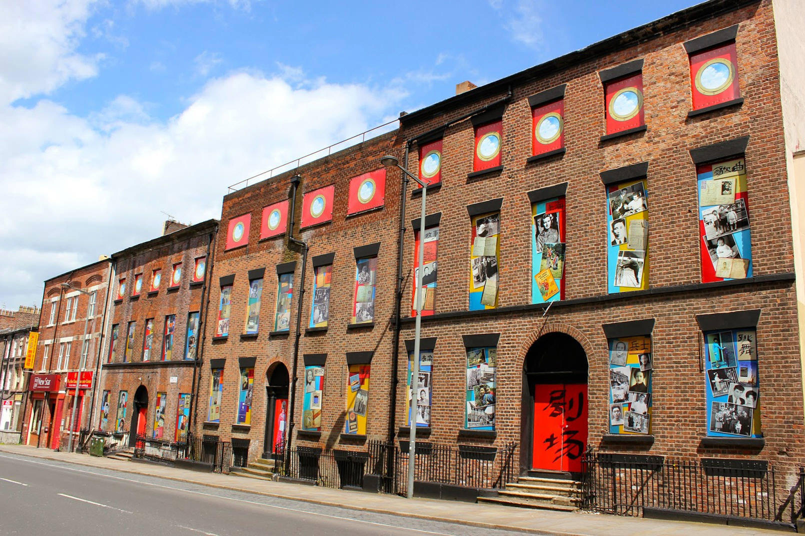 The "Opera for Chinatown" art installation, on Liverpool's Duke Street, features photos of the old boarding house's long forgotten residents .
