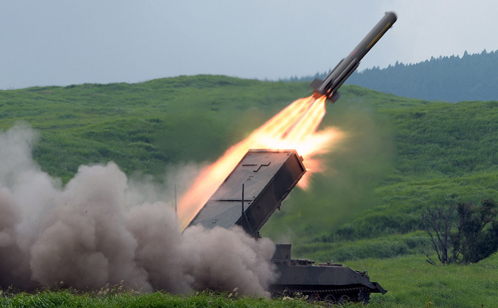 A Japanese Self-Defense Forces type-92 anti-mine rocket launcher fires a missile during an annual live fire exercise in August 2013 in this file image. Photo: AFP