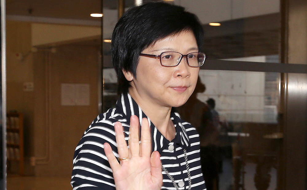 Rita Lau leaves the High Court.