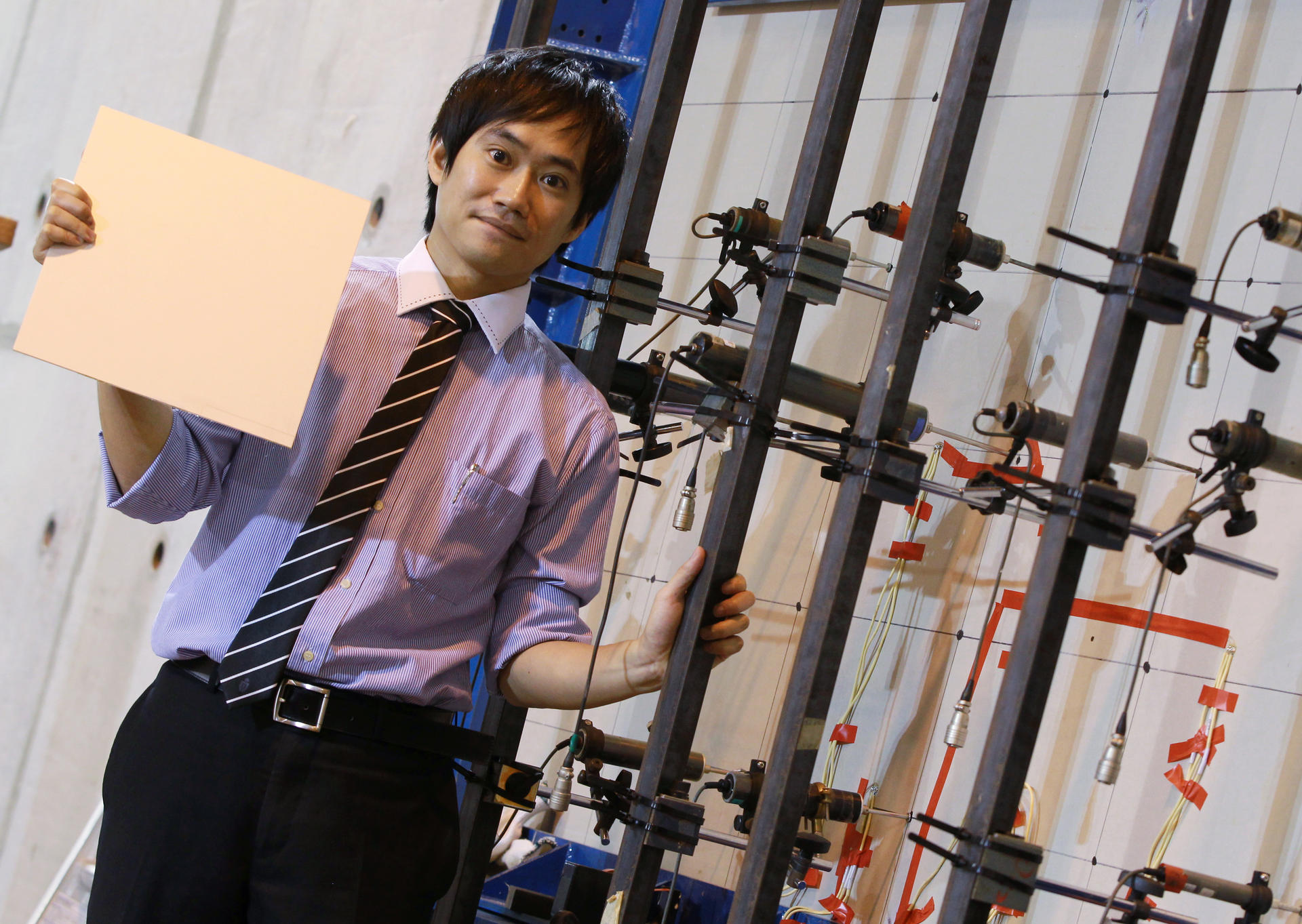 Ben Chan, of the University of Science and Technology, shows off the new fibre-reinforced aluminium. Photo: Edward Wong