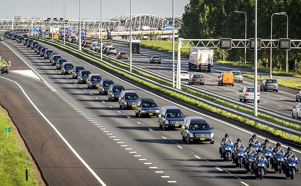A convoy of funeral hearses carrying the remains of the victims of the MH17 plane crash is driven from the airbase in Eindhoven to Hilversum, the Netherlands, on Thursday. Two more planes carrying bodies are scheduled to arrive on Friday. Photo: EPA