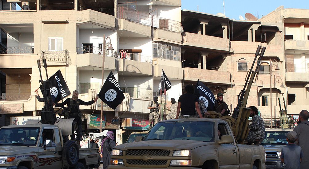 Members of the Islamic State militant group parade in a street in the northern Syrian city of Raqa. Photo: AFP
