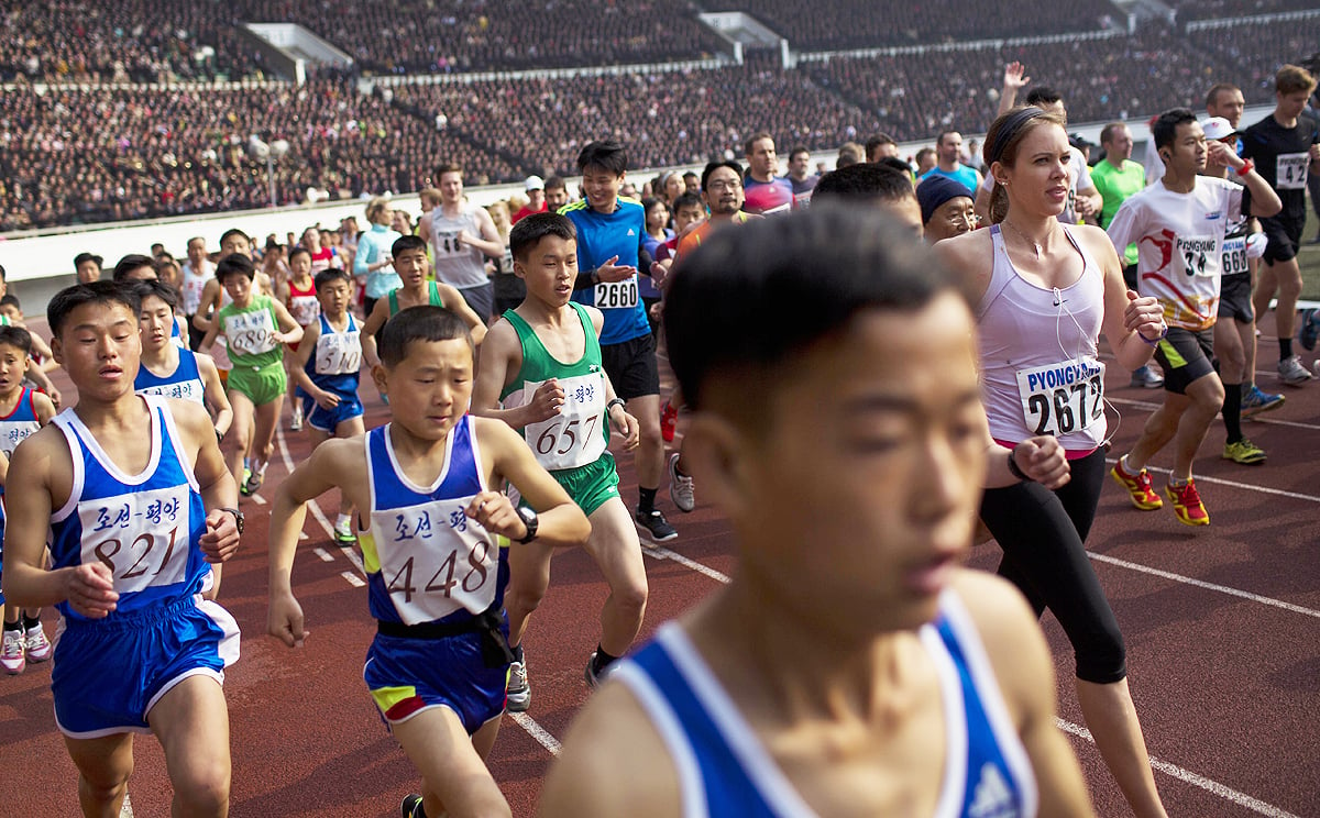 Runners take off inside Kim Il-sung Stadium at the beginning of the Mangyongdae Prize International Marathon in Pyongyang. Photo: AP